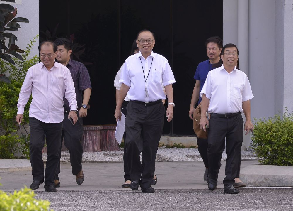 Bukit Bintang MP Fong Kui Lun (centre) walks out of the MACC office after lodging a report over the Ramadan bazaar controversy in Kuala Lumpur June 21, 2018. u00e2u20acu2022 Picture by Razak Ghazali