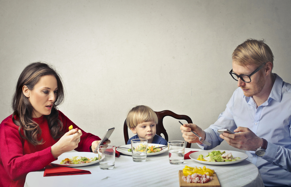 Parents who spend a lot of time on their phones or watch television during family activities could be contributing to their children's bad behaviour according to new research. u00e2u20acu201d bowie15/IStock.com pic via AFP