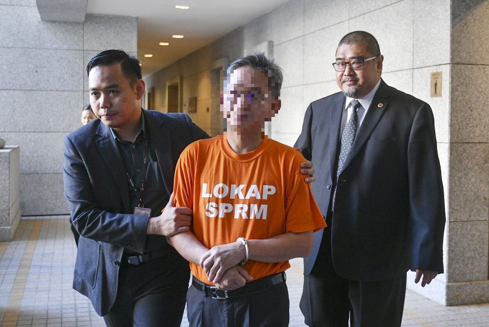 A u00e2u20acu02dcDatuku00e2u20acu2122 from a prominent a government-linked company was remanded by the Malaysia Anti Corruption Commission today, June 28, 2018. u00e2u20acu2022 Picture by Azinuddin Ghazali