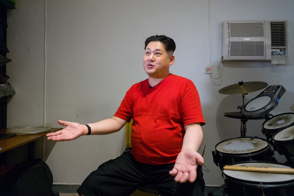 A Kim Jong-un impersonator, who goes by the name Howard X, gestures during an interview with AFP in his studio in Hong Kong on June 7, 2018. u00e2u20acu201d AFP pic