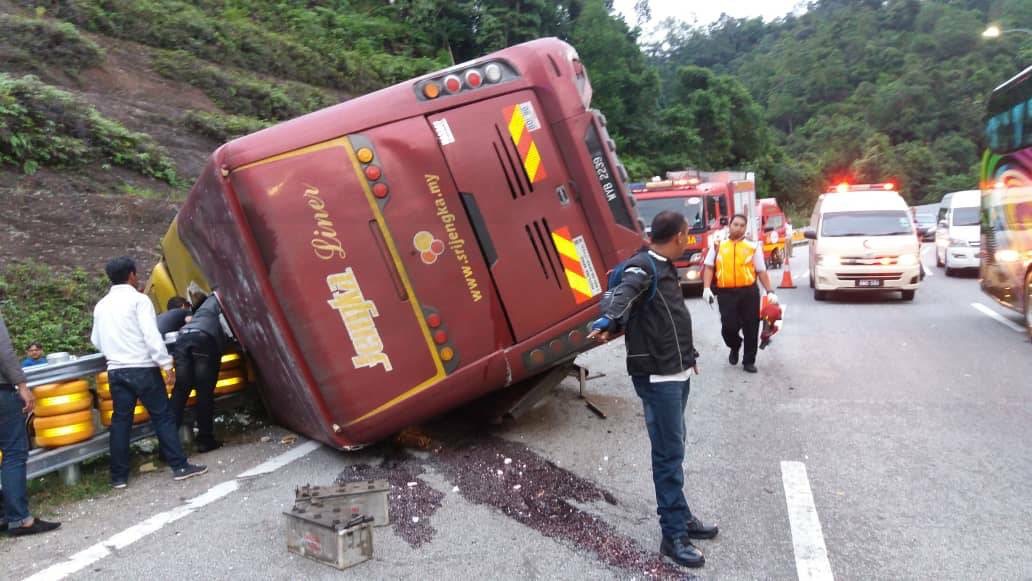 An express bus ferrying 42 people crashed into a road divider near the Karak HIghway earlier today, leaving one dead and two seriously injured. u00e2u20acu201d Picture courtesy of the Selangor Fire and Rescue Department