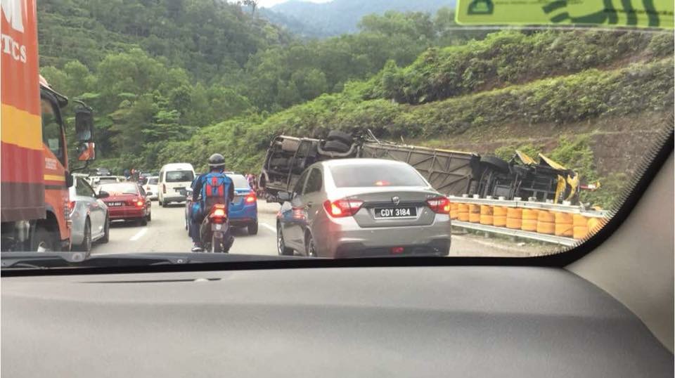 An express bus ferrying 42 people crashed into a road divider near the Karak HIghway earlier today, leaving one dead and two seriously injured. u00e2u20acu201d Picture courtesy of the Selangor Fire and Rescue Department