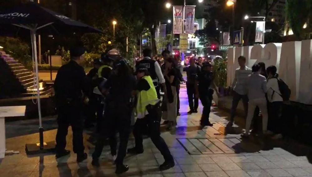 Police detain South Korean protesters across St Regis on June 11, 2018 in this still image taken from video. u00e2u20acu2022 Picture by Kenneth Chang/TODAY