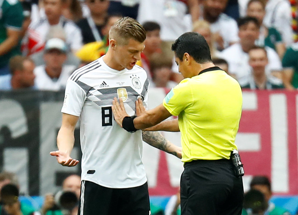 Germany's Toni Kroos speaks with referee Alireza Faghani during the World Cup Group F match with Mexico in Moscow June 17, 2018. u00e2u20acu201d Reuters pic