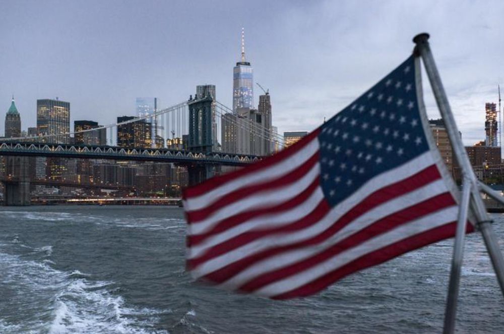 The Lower Manhattan skyline, One World Trade Center and Manhattan Bridge are seen in the background as a ferry with a US flag cruises along the East River in New York, September 21, 2015. u00e2u20acu201d Reuters pic