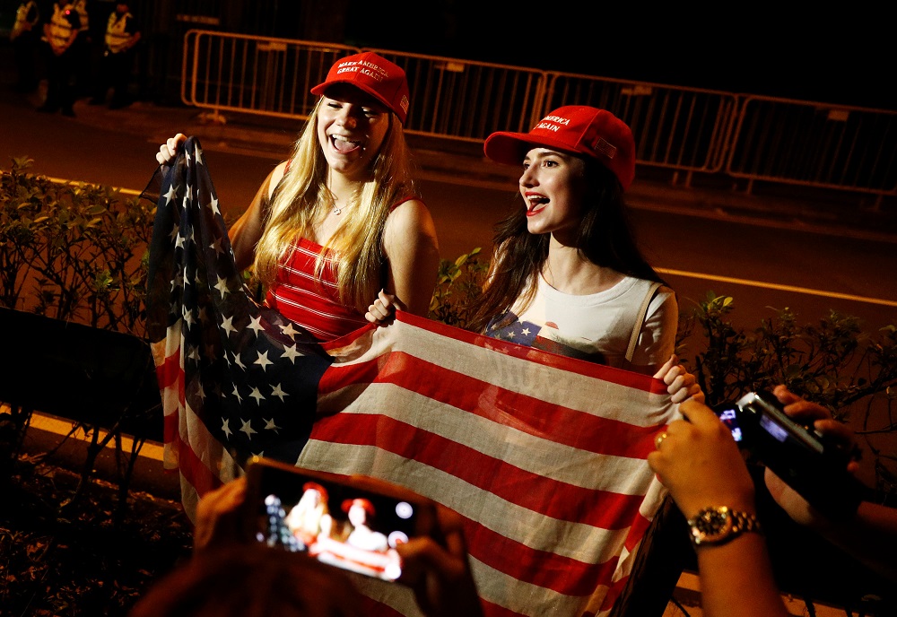 American students Erica Lynn Boland (right) and Christina Anne started waiting for US President Donald Trump outside Shangri-La from 6pm on Sunday. u00e2u20acu201d Reuters pic