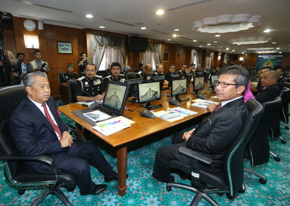 Tan Sri Muhyiddin Yassin holds a briefing with Datuk Seri Mustafar Ali (second left) and Datuk Seri Alwi Hj Ibrahim (right) at the Immigration Department in Putrajaya June 5, 2018. u00e2u20acu2022 Picture by Zuraneeza Zulkifli