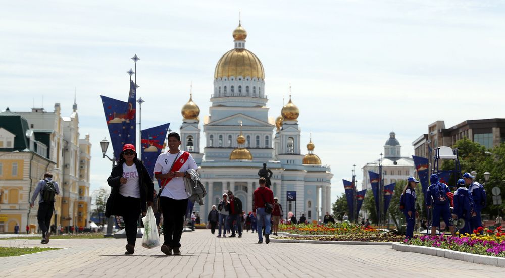 Fans of Peruu00e2u20acu2122s football team walk in front of the Russian Orthodox cathedral of Saint Theodore Ushakov in Saransk, Russia June 15, 2018. u00e2u20acu201d Reuters pic
