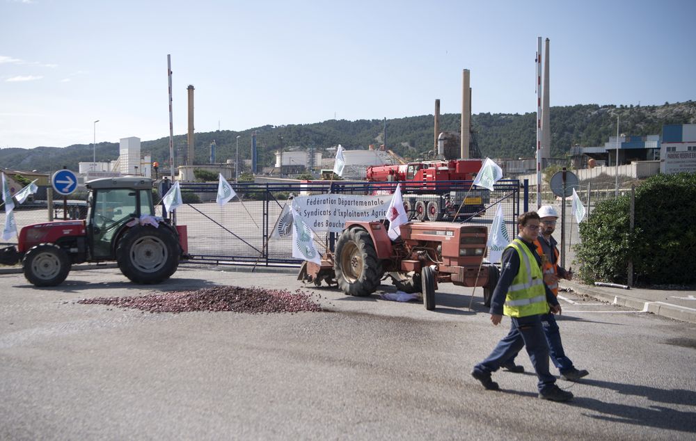 Workers blocking the access of French oil giant Totalu00e2u20acu2122s La Mede refinery in Chateauneuf-les-Martigues, France, on June 11, 2018 as union members demonstrate against the government authorisation to import palm oil. u00e2u20acu201d AFP pic