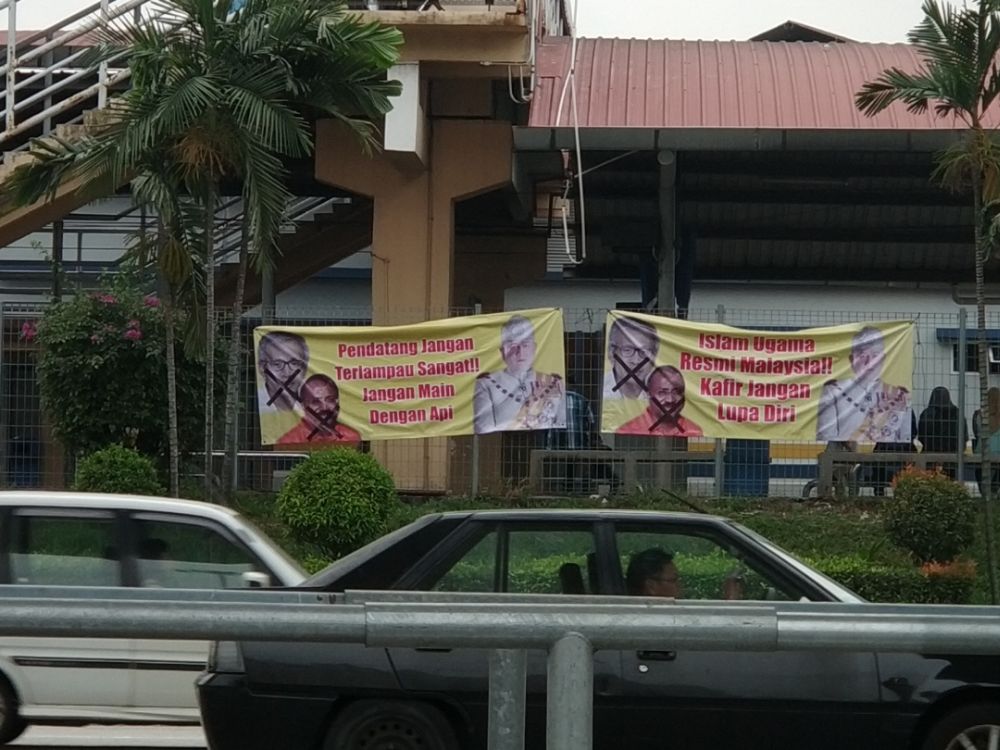 The provocative yellow banners were seen outside a train station in Kg Dato Haron. u00e2u20acu2022 Picture by Yiswaree Palansamy