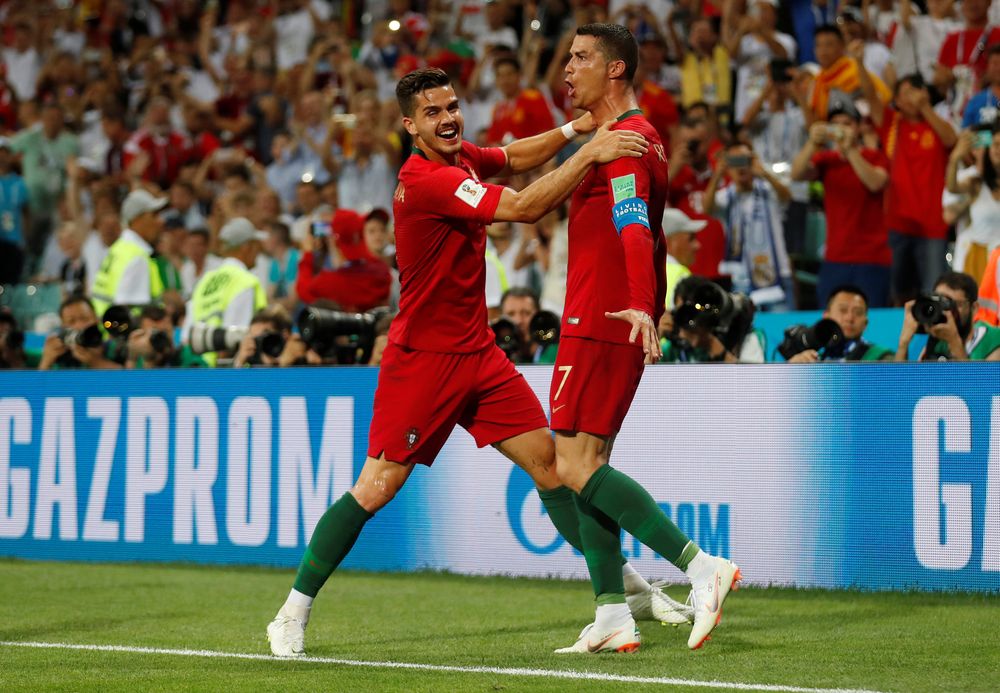 Portugalu00e2u20acu2122s Cristiano Ronaldo celebrates with Andre Silva after scoring their third goal to complete his hat-trick during the World Cup Group B - Portugal vs Spain match in Fisht Stadium, Sochi, Russia, June 15, 2018. u00e2u20acu201d Reuters pic