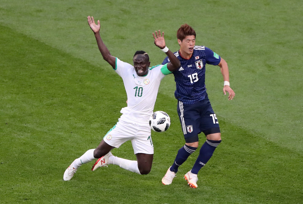 Senegal's Sadio Mane (left) in World Cup  Group H action with Japan's Hiroki Sakai in Yekaterinburg June 24, 2018. u00e2u20acu201d Reuters pic