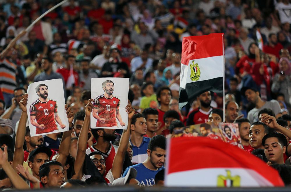 Egyptian fans carry a poster of Egyptu00e2u20acu2122s Mohamed Salah during the training in Cairo international stadium in Cairo. u00e2u20acu201d Reuters pic