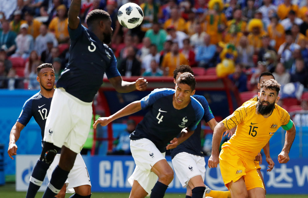 France's Samuel Umtiti (left) handles the ball in the area resulting in a penalty being awarded to Australia in their World Cup Group C match in Kazan June 16, 2018. u00e2u20acu201d Reuters pic