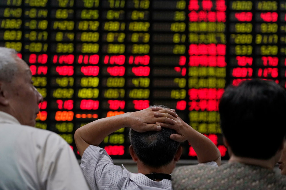 Investors look at an electronic board showing stock information at a brokerage house in Shanghai June 20, 2018. u00e2u20acu201d Reuters pic