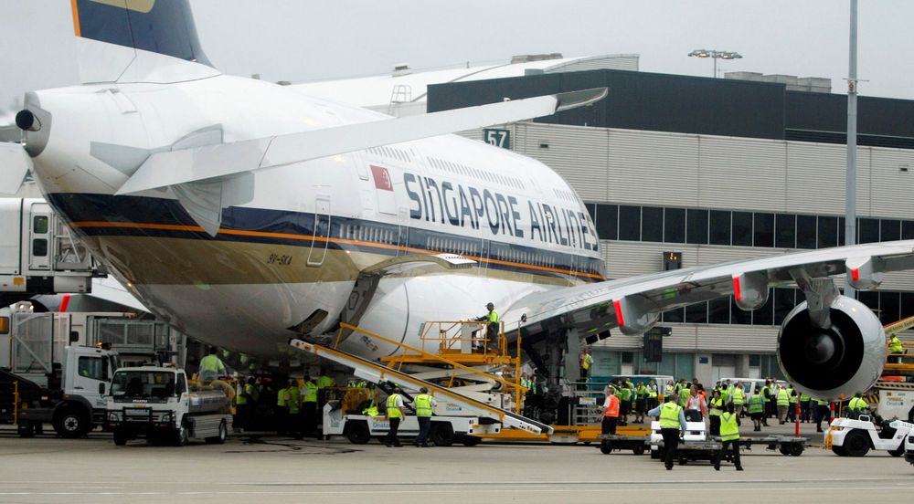 File picture shows airport workers crowding around the first scheduled commercial flight of an Airbus A380 after it landed at Sydney International airport after flying from Singapore, October 25, 2007. u00e2u20acu201d Reuters pic