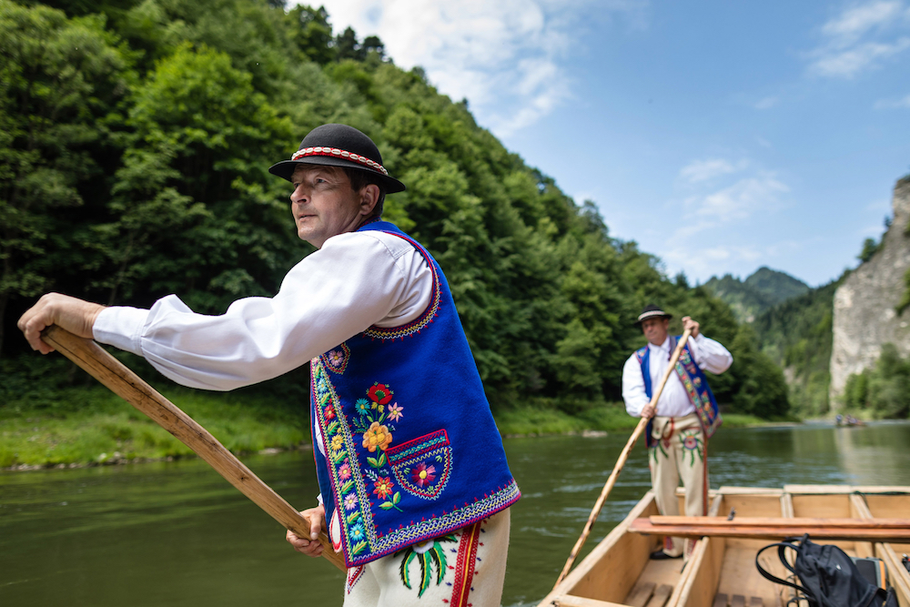 Polish river guides Stanislaw Migdal (lef) and Czeslaw Kowalczyk propel their raft on the Dunajec River through the landscape of the Pieniny National Park in southern Poland. u00e2u20acu201d AFP pic