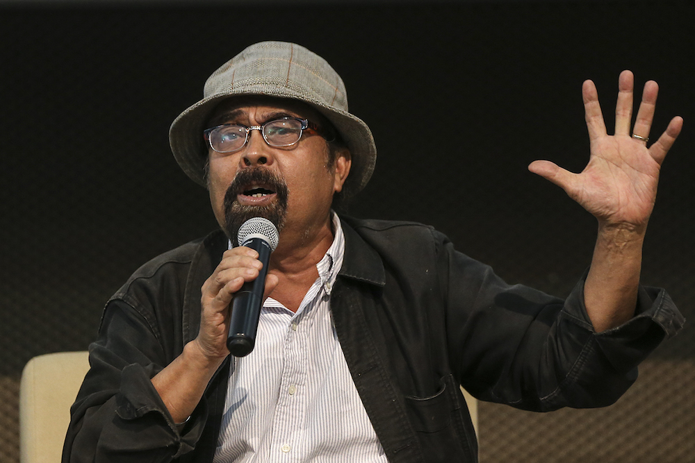 Political activist Hishamuddin Rais speaks during the forum at Dewan Pustaka Rakyat July 11, 2018. u00e2u20acu201d Picture by Azneal Ishak