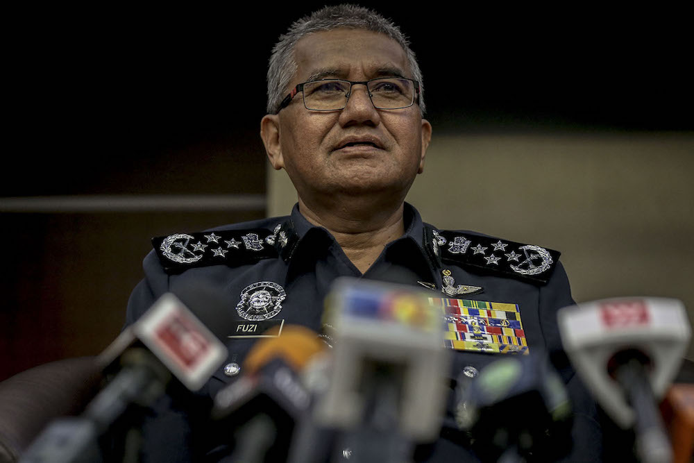 Inspector General of Police, Tan Sri Mohamad Fuzi Harun, speaks at a press conference in Bukit Aman July 11, 2018. u00e2u20acu201d Picture by Hari Anggara