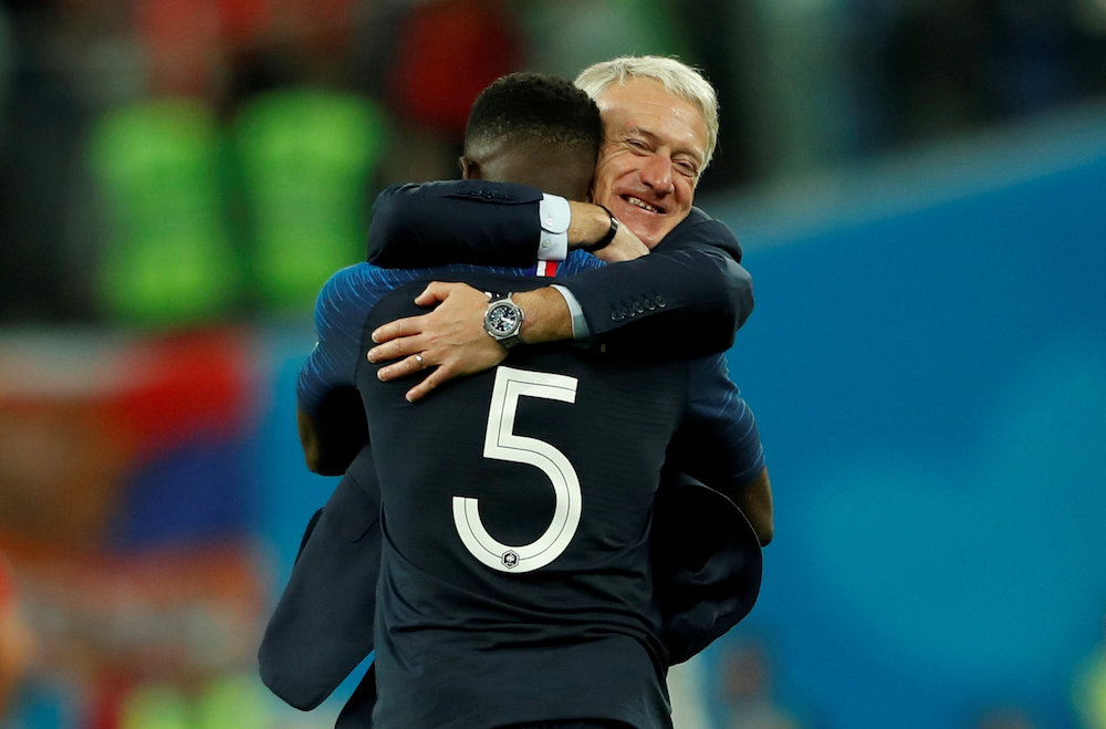 France coach Didier Deschamps celebrates with Samuel Umtiti at the end of the match against Belgium in Saint Petersburg, July 11, 2018. u00e2u20acu201d Reuters pic