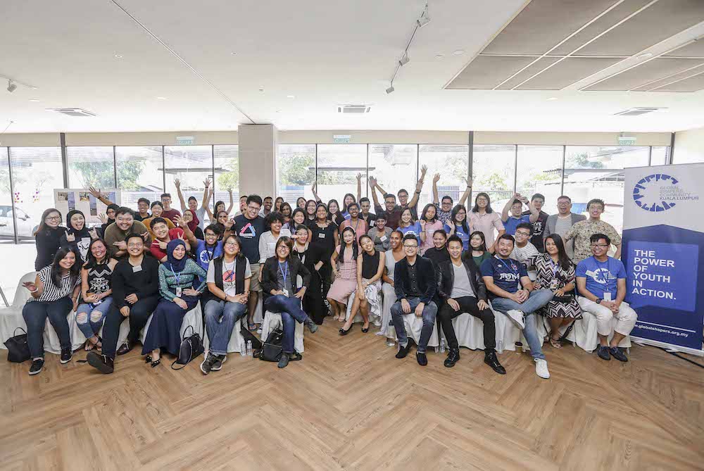 Participants take a group photo after the Global Shapers KL Open Day & Fundraising Event in Kuala Lumpur July 14, 2018. — Picture by Firdaus Latif