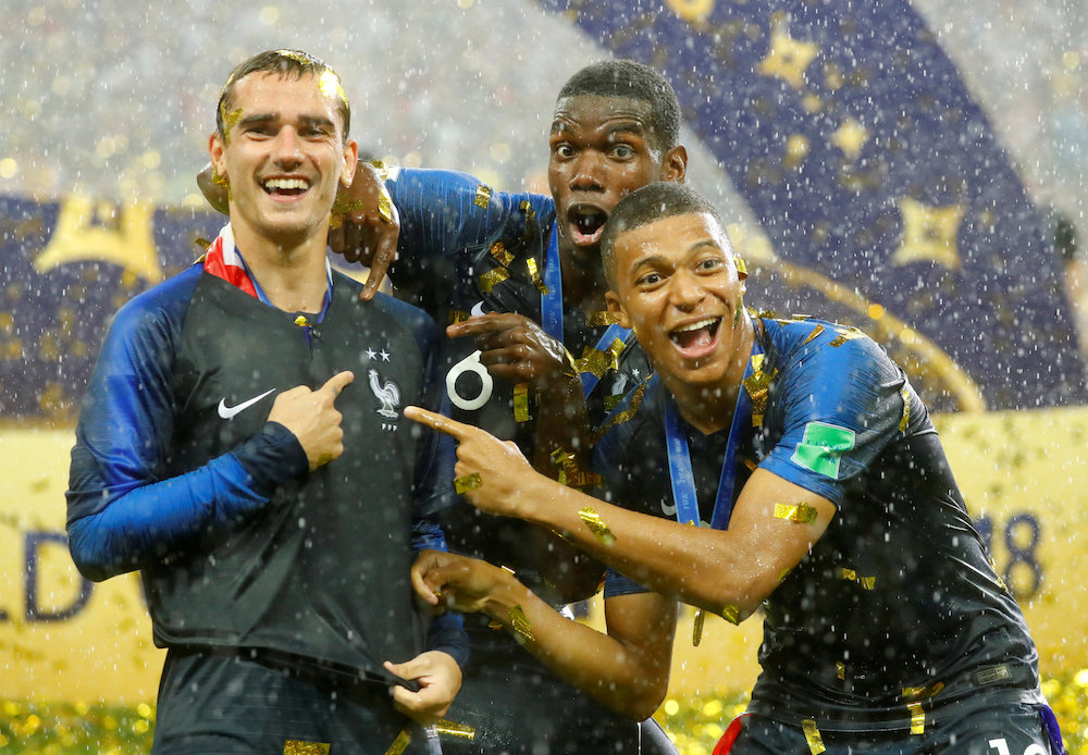 Franceu00e2u20acu2122s Antoine Griezmann, Paul Pogba and Kylian Mbappe celebrate after winning the World Cup in Moscow July 16, 2018. u00e2u20acu201d Reuters pic