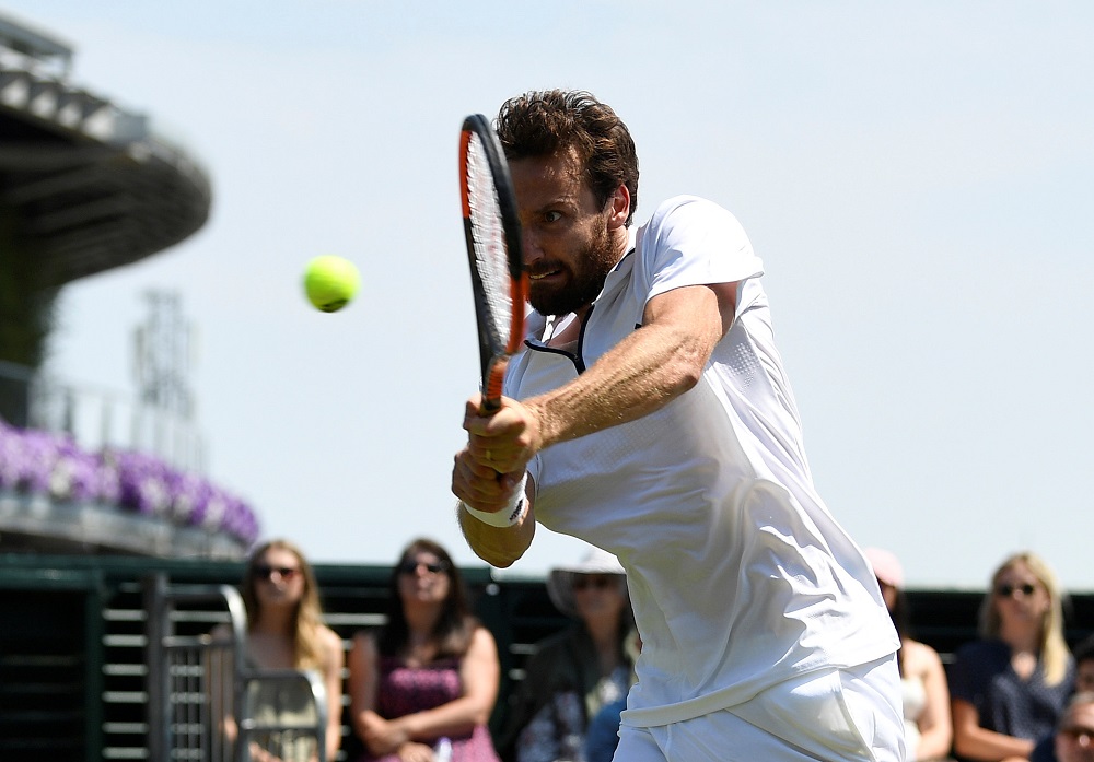 Ernests Gulbis in action during the first round match against Jay Clarke in London July 3, 2018. u00e2u20acu201d Reuters pic