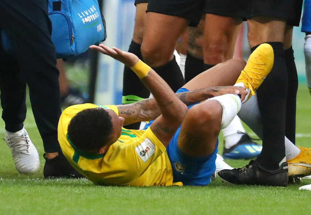 Brazil’s Neymar reacts on the sideline after sustaining an injury during the match against Mexico at the 2018 Fifa World Cup in Samara July 2, 2018.
