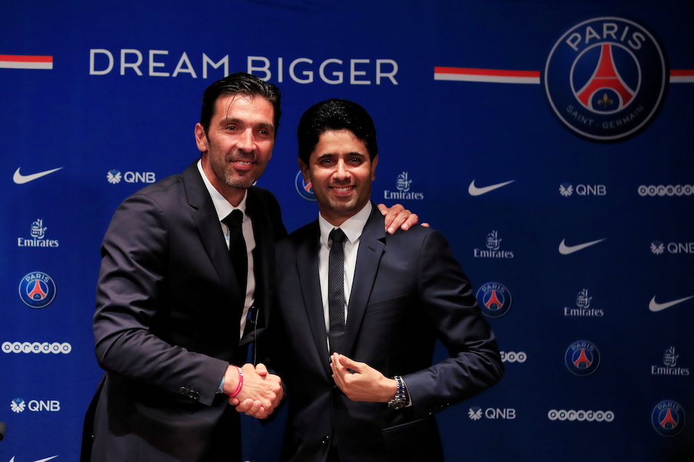 New Paris St Germain goalkeeper Gianluigi Buffon and president Nasser Al-Khelaifi pose for a photograph during the press conference in Paris July 9, 2018. u00e2u20acu201d Reuters pic
