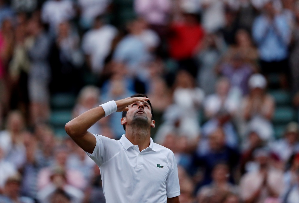 Novak Djokovic celebrates winning the fourth round match against Karen Khachanov in London July 9, 2018. u00e2u20acu201d Reuters pic