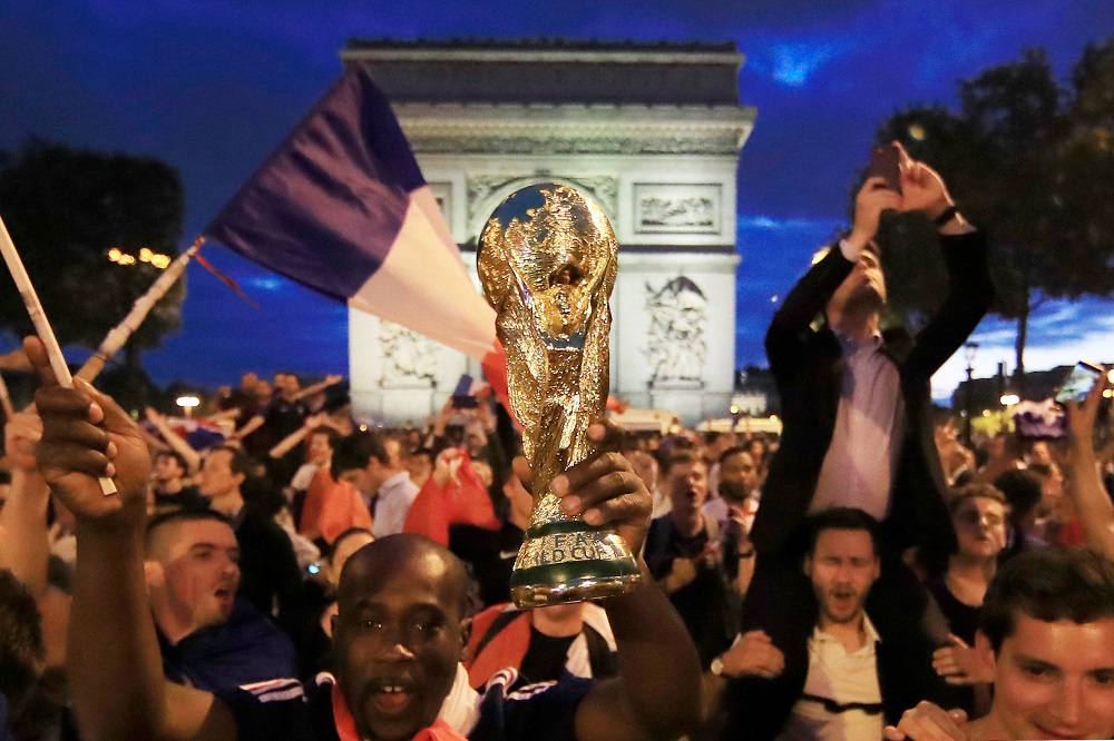 France fans react on the Champs-Elysees after defeating Belgium in their World Cup semi-final match in Paris July 10, 2018. u00e2u20acu201d Reuters pic 