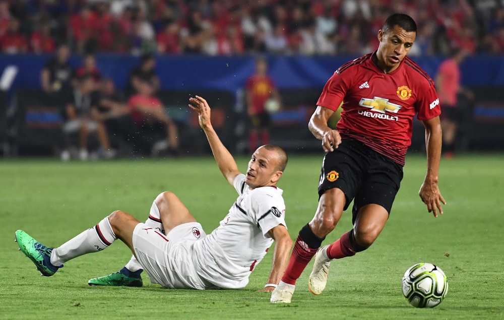 Manchester United's Alexis Sanchez moves the ball away from Milan's Luca Antonelli in the second half during an International Champions Cup football match at Stubhub Centre July 25, 2018. u00e2u20acu201d Picture by Robert Hanashiro-USA TODAY Sports via Reuters