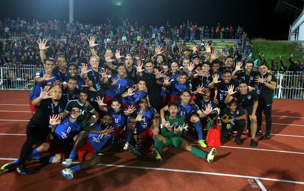 JDT players pose for a group photo after defeating Perak 2-1 and subsequently winning the Malaysian Super League title for the fifth time, at the Perak Stadium in Ipoh July 10, 2018. u00e2u20acu201d Picture by Farhan Najib
