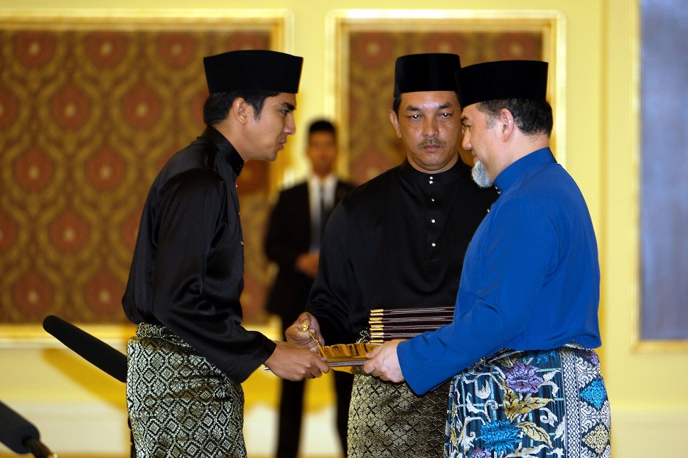 Syed Saddiq Syed Abdul Rahman (left) is sworn in as the youth and sports minister in the presence of Yang di-Pertuan Agong Sultan Muhammad V at the Istana Negara in Kuala Lumpur July 2, 2018. u00e2u20acu201d Bernama pic