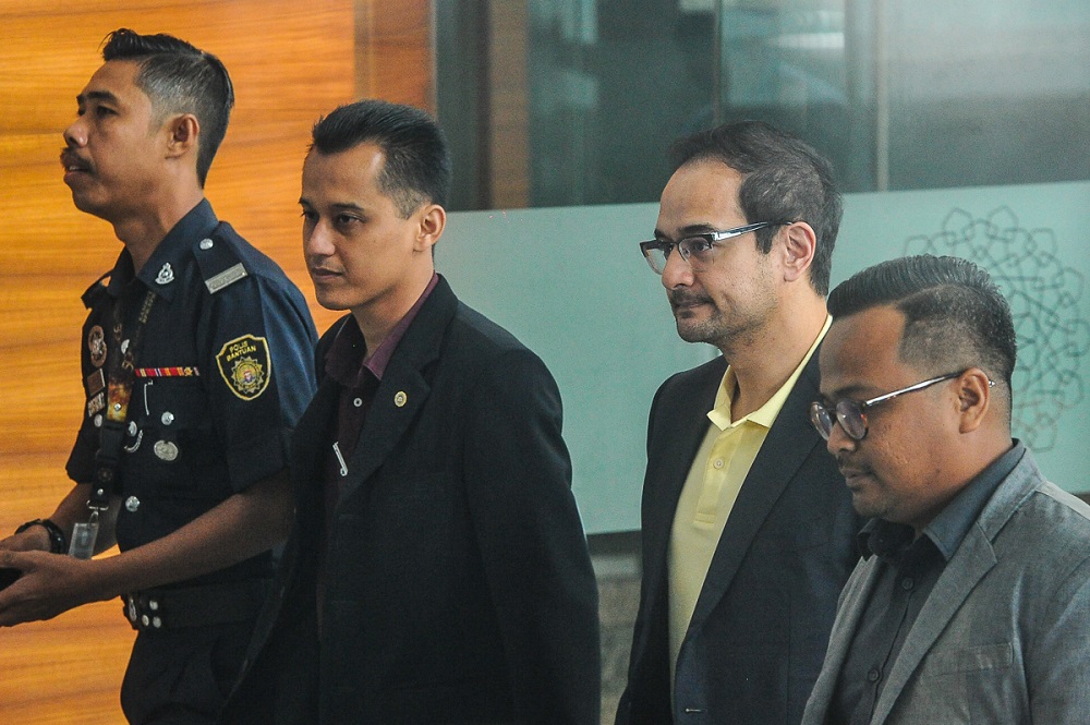 Datin Seri Rosmah Mansor's son, Riza Aziz (second right), arrives at the Malaysian Anti-Corruption Commissionu00e2u20acu2122s headquarters in Putrajaya July 3, 2018. u00e2u20acu201d Picture by Shafwan Zaidon