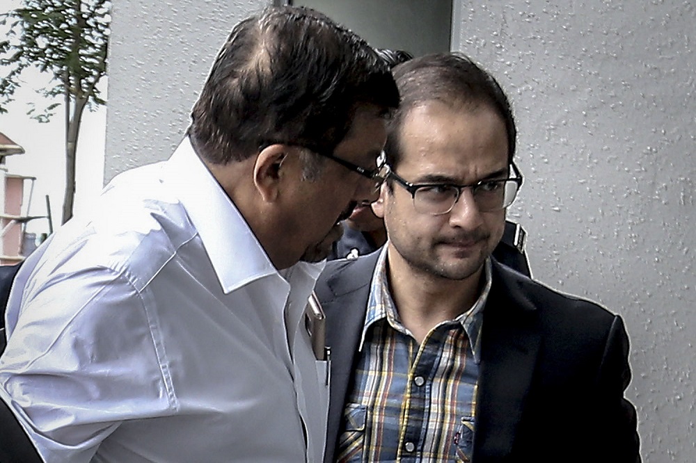 Riza Aziz and his lawyer Datuk K. Kumaraendran (right) arrive at the Malaysian Anti-Corruption Commissionu00e2u20acu2122s headquarters in Putrajaya July 4, 2018. u00e2u20acu201d Picture by Hari Anggara