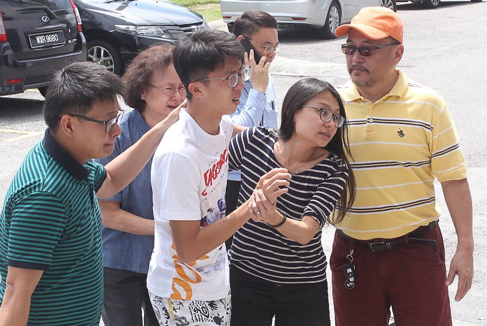 Eddie Ngu00e2u20acu2122s relatives gather at Serdang Hospital in Sepang July 20, 2018, following his death in a car accident.