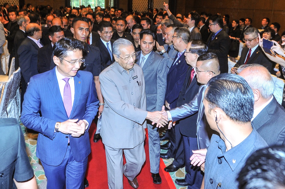 Prime minister Tun Dr Mahathir Mohamad (centre) is greeted by attendees at the ACCCIM 72nd Annual General Meeting at the Mandarin Oriental hotel in Kuala Lumpur July 20, 2018. u00e2u20acu201d Picture by Shafwan Zaidon