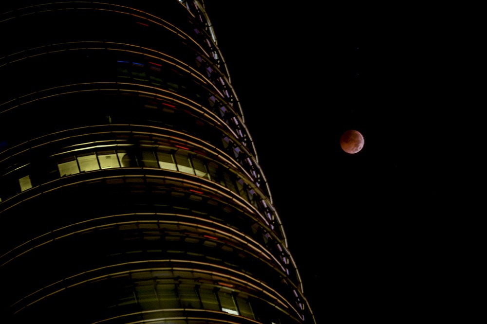 The ‘blood moon’ eclipse, as seen from KLCC in Kuala Lumpur July 28, 2018. — Picture by Hari Anggara