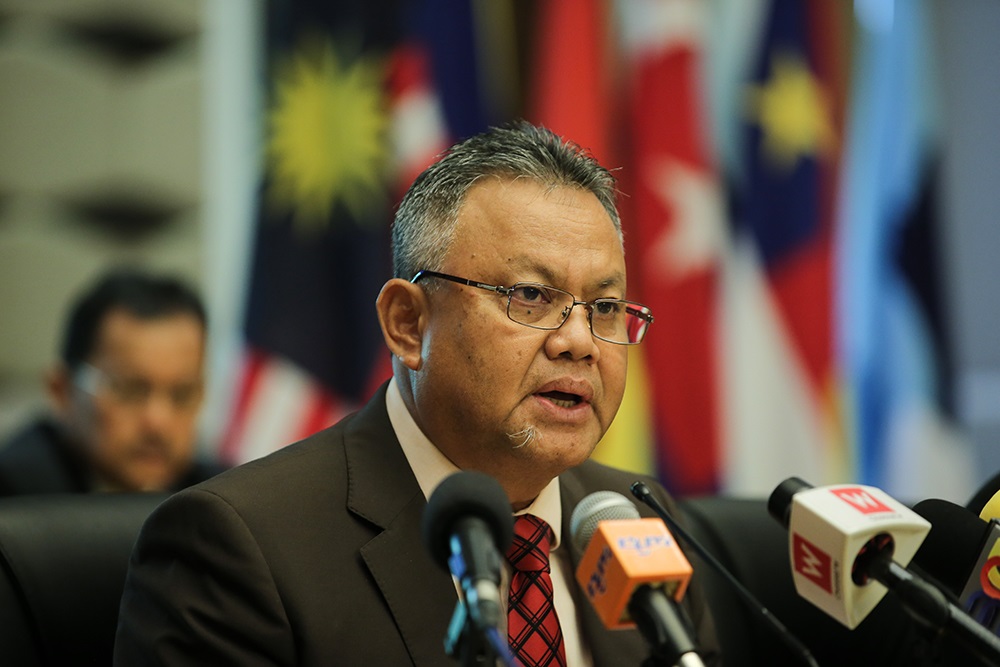 Election Commission deputy chairman Tan Sri Othman Mahmood speaks during a press conference in Putrajaya July 30, 2018. u00e2u20acu201d Picture by Miera Zulyana