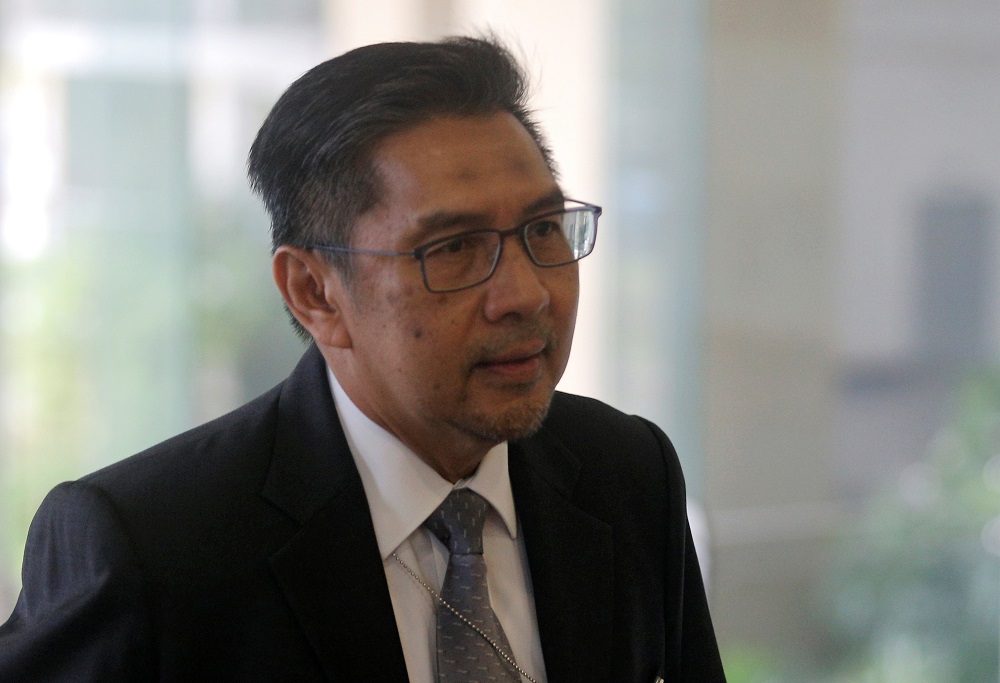 Director General of Civil Aviation Malaysia, Datuk Seri Azharuddin Abdul Rahman, arrives for an MH370 meeting in Putrajaya July 30, 2018. u00e2u20acu201d Reuters pic