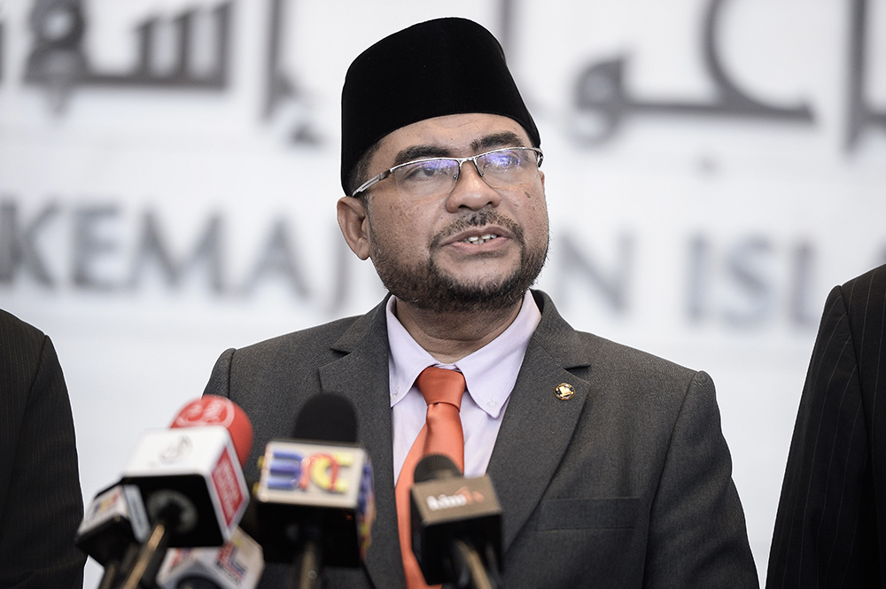 Minister of Religious Affairs, Datuk Mujahid Yusof speaks to reporters in Putrajaya July 30, 2018. u00e2u20acu201d Picture by Miera Zulyana