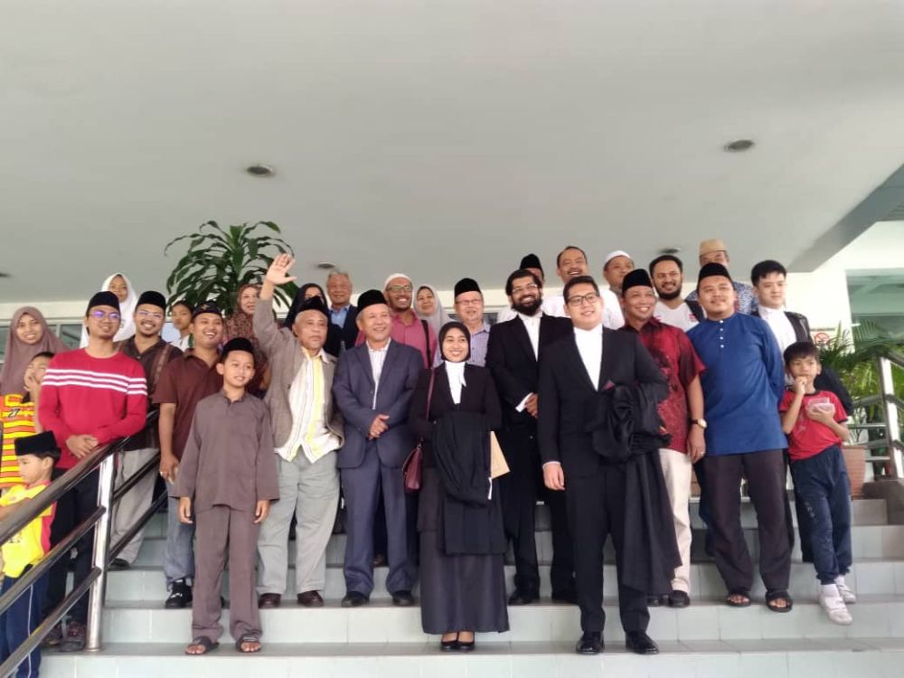 The Ahmadiyya community celebrates with their lawyers after the decision by the Shah Alam High Court today, July 6, 2018. u00e2u20acu2022 Picture courtesy of Jemaat Ahmadiyyah