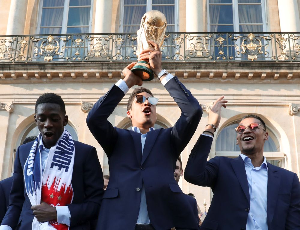 France's goalkeeper Alphonse Areola holds up the winner's trophy in the grounds of the Elysee Presidential Palace during an official reception in Paris July 16, 2018. u00e2u20acu2022 Reuters pic 