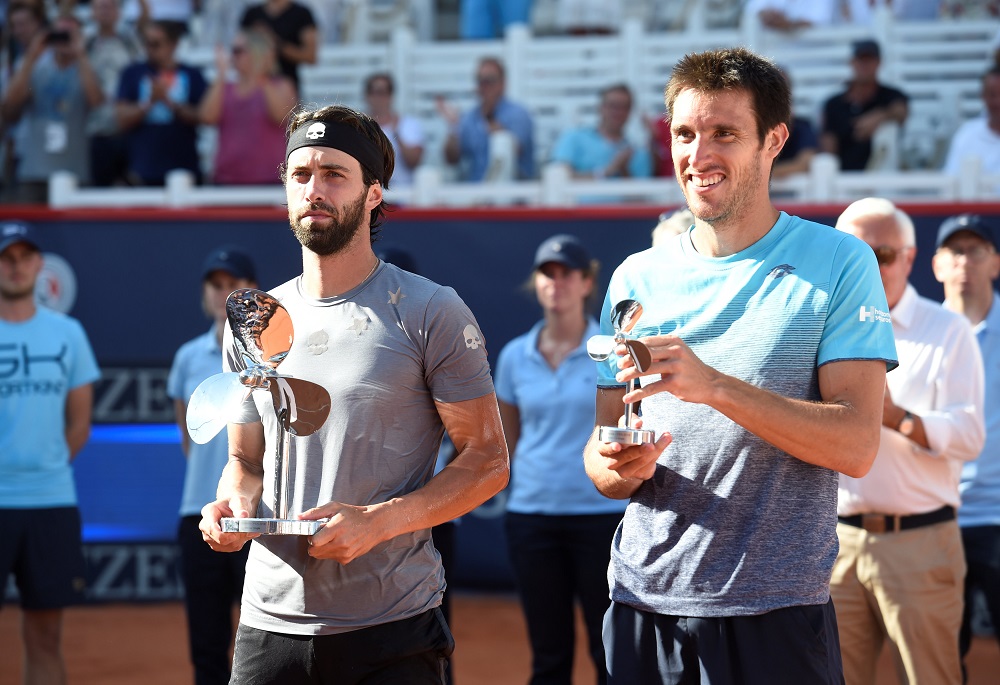 Georgiau00e2u20acu2122s Nikoloz Basilashvili celebrates winning the final with runner-up Argentinau00e2u20acu2122s Leonardo Mayer at the German Tennis Championships in Hamburg July 29, 2018. u00e2u20acu201d Reuters pic