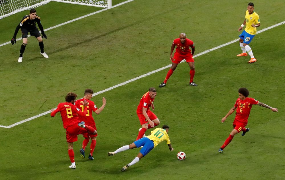 Neymar goes down in the penalty area after a challenge by a Belgian player at the Kazan Arena in Kazan, Russia, July 7, 2018. u00e2u20acu201d Reuters picnn