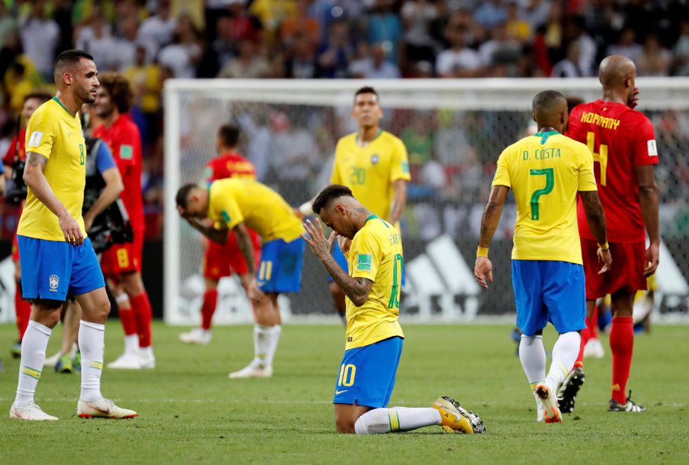 Brazilu00e2u20acu2122s Neymar and team mates look dejected at the end of their quarter final match against Belgium at the Kazan Arena in Russia, July 7, 2018. u00e2u20acu201d Reuters pic