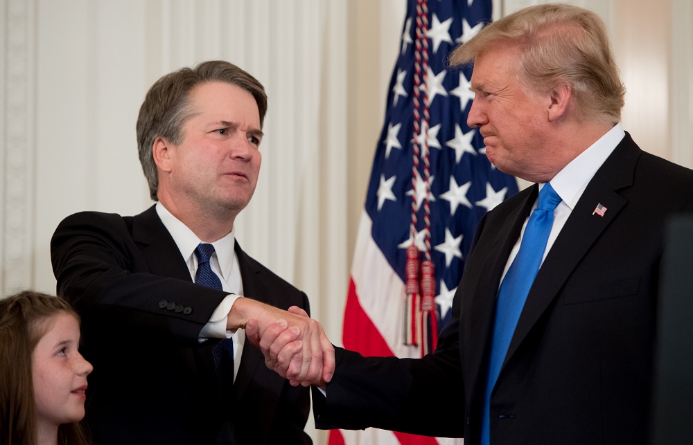US Judge Brett Kavanaugh (left) shakes hands with US President Donald Trump after being nominated to the Supreme Court in the East Room of the White House on July 9, 2018. u00e2u20acu201d AFP pic