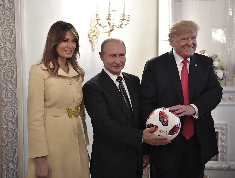 Russia's President Vladimir Putin, US President Donald Trump and First lady Melania Trump pose for a picture with a football during a meeting in Helsinki, Finland July 16, 2018. u00e2u20acu201d Reuters pic