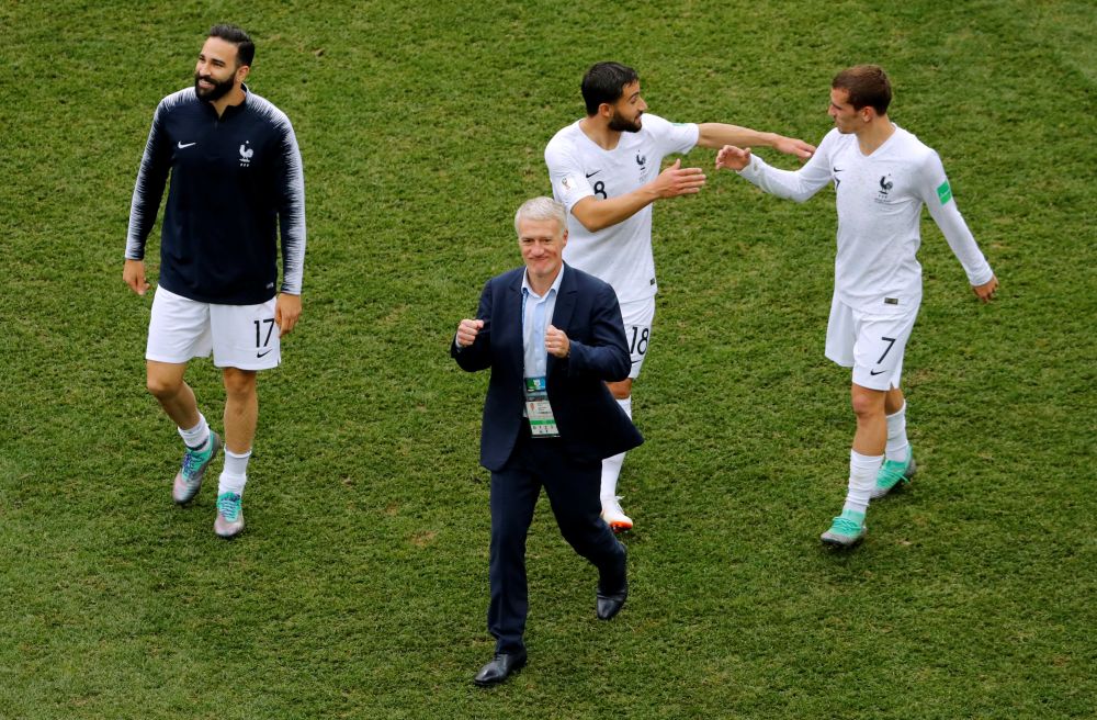 France coach Didier Deschamps celebrates after the match with Antoine Griezmann, Adil Rami and Nabil Fekir at the Novgorod Stadium in Nizhny Novgorod, Russia, July 7, 2018. u00e2u20acu201d Reuters picnn